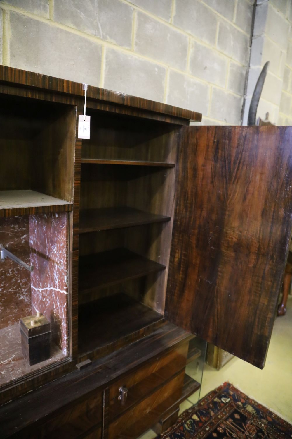 A Continental figured walnut marble inset side cabinet, W.200cm, D.50cm, H.173cm